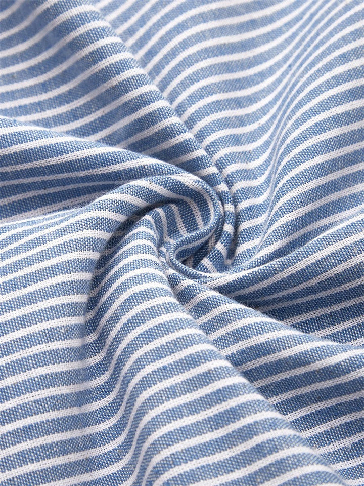 Relaxed fit striped midi dress for women, with elegant button accents, great for a stylish casual summer outfit.