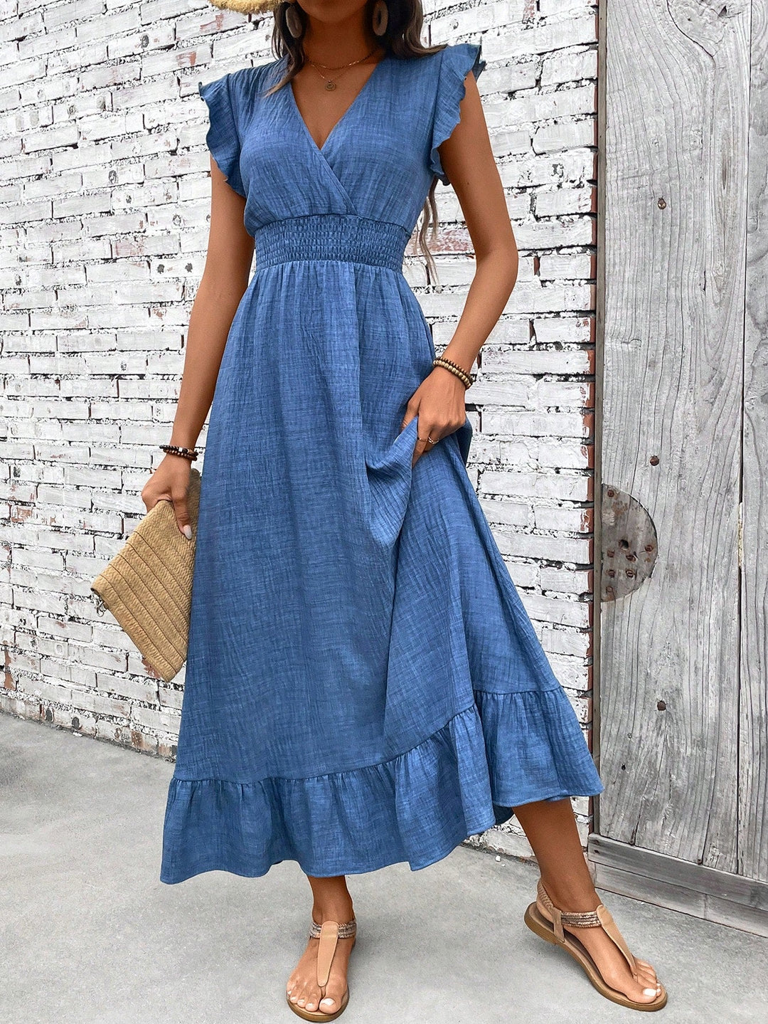 Women's blue V-neck smocked waist ruffle maxi dress. Comfortable, casual, and boho summer style.