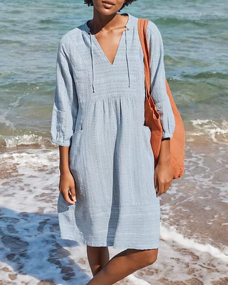 Elegant women's bohemian midi dress with V-neck, ideal for summer, vacation, and everyday casual style.