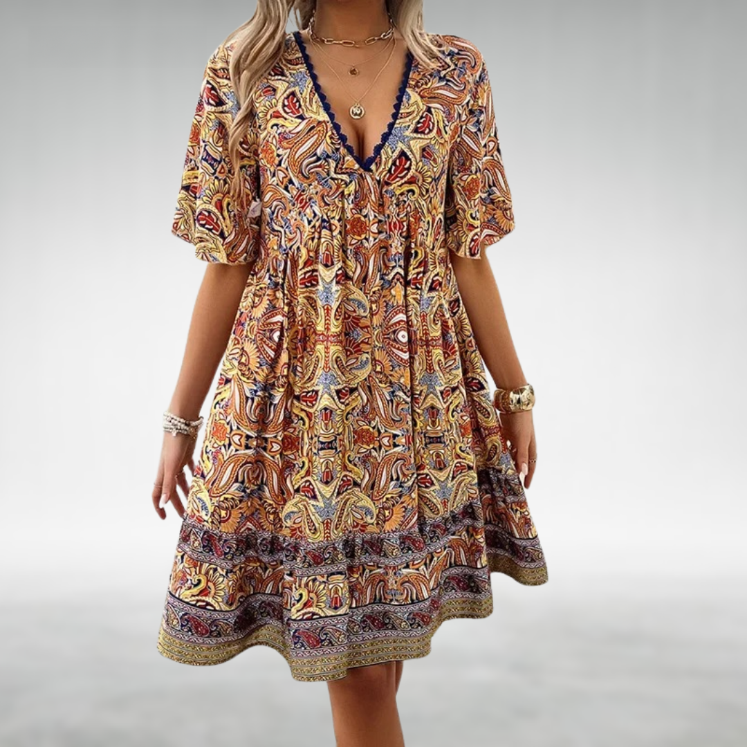 Women's boho mini dress with vibrant paisley print & short sleeves, perfect for summer casual wear or vacation.