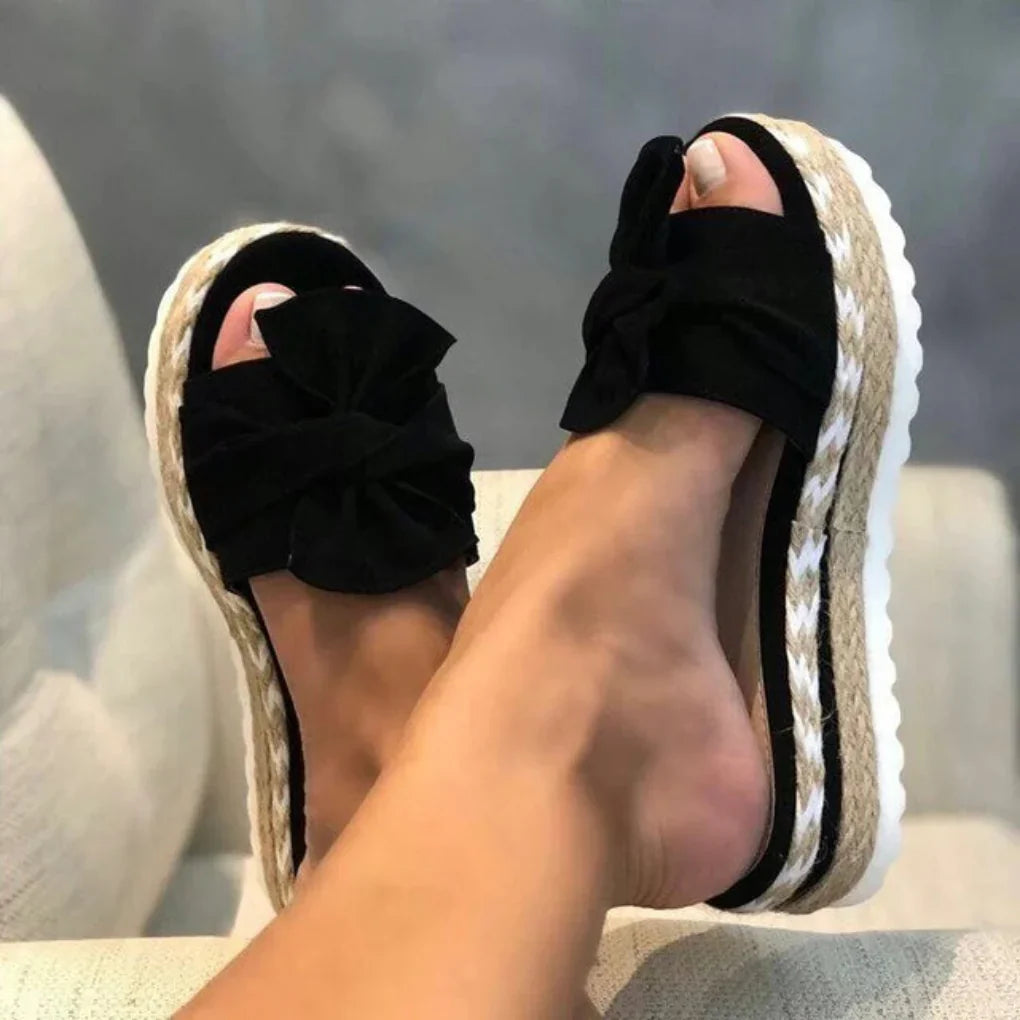 Stylish women's platform slide sandals featuring a cute bow, perfect for casual summer wear