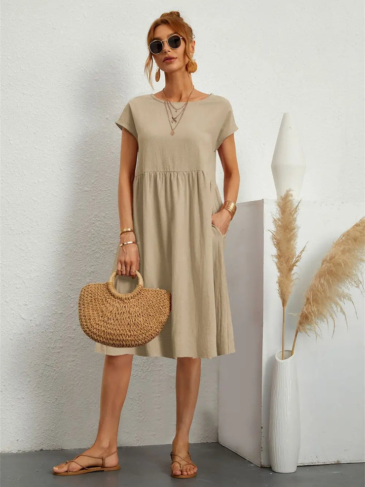 Lightweight women's midi dress with pockets, perfect short sleeve casual wear for summer and spring.