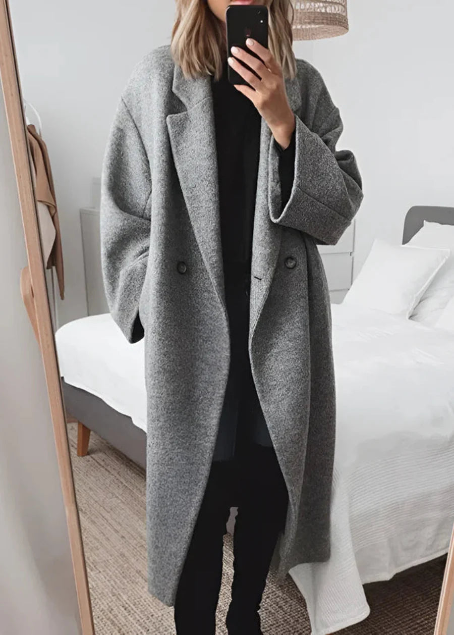Sophisticated women's maxi coat. Oversized design for elegant winter fashion and cozy cold weather layering.