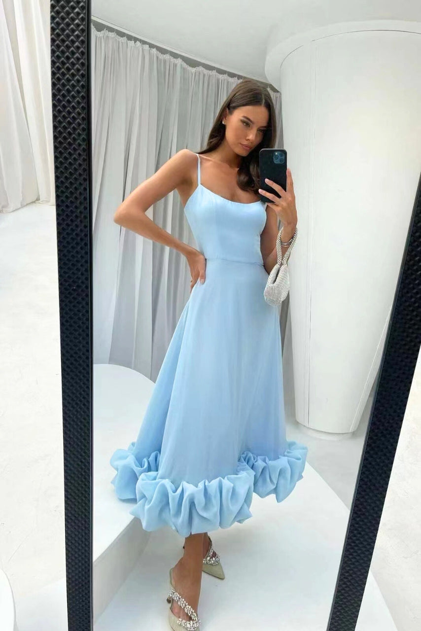 Elegant women's flowy twirl midi dress, perfect as a chic wedding guest or party outfit.