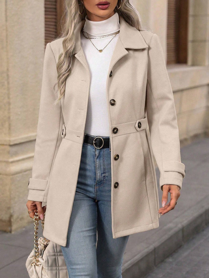 Versatile women's belted trench coat, ideal spring jacket & fall outerwear for a professional, elegant style.