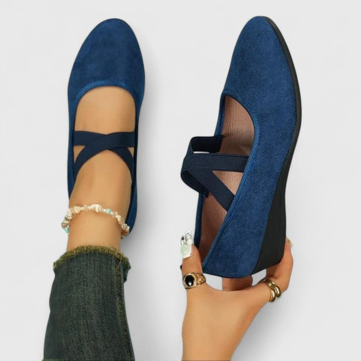 Stylish women's wedge sandals with a closed toe and comfortable elastic crossover straps; versatile summer footwear.