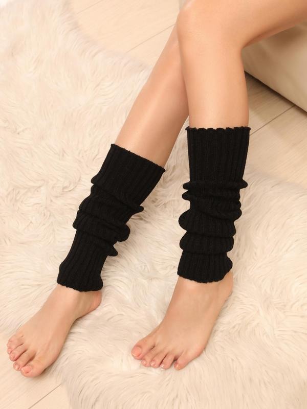 Close-up of women's chunky ribbed knit leg warmers, showing texture and warmth for cold weather.