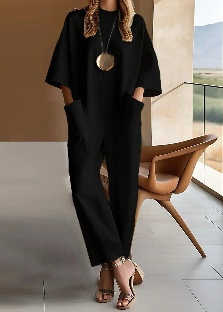 Chic women's short sleeve wide leg jumpsuit, ideal for relaxed vacation outfits & easy wear.