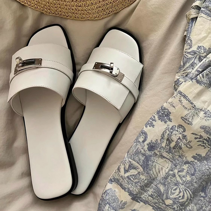 Women's elegant black leather square toe slides with metallic buckle, perfect for summer casual wear.