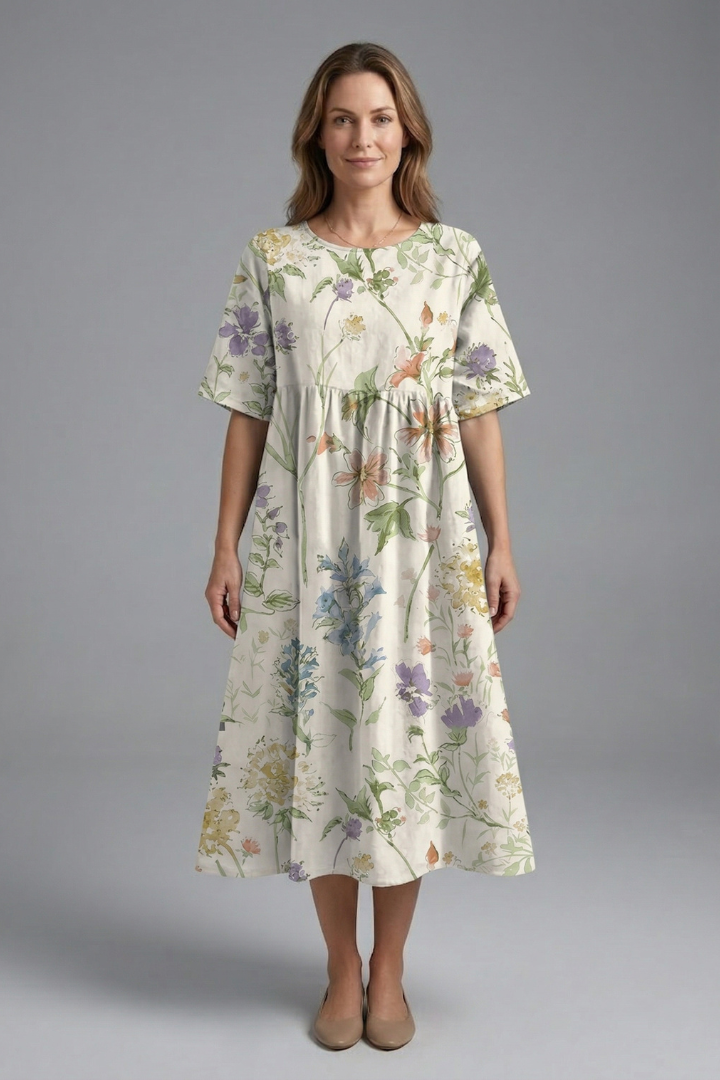 Beautiful spring/summer women's midi dress with a colorful floral print, short sleeves & graceful flared skirt.