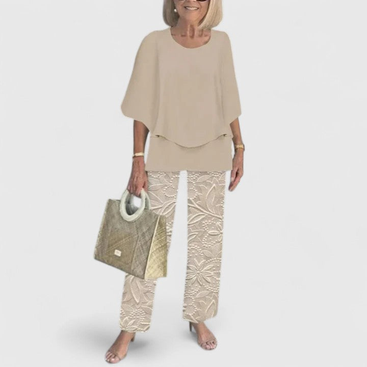 Fashionable women's two piece set: floral print wide leg trousers & elegant top.