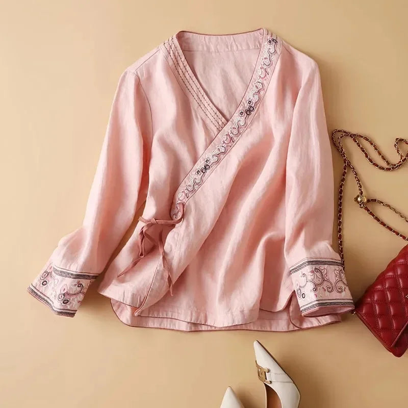 Embroidered patterned women's blouse, relaxed fit, V-neck. Stylish & comfortable for versatile wear.