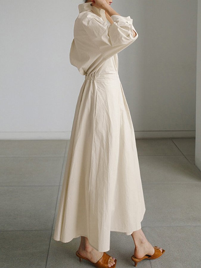 Stylish women's puff sleeve maxi shirt dress with twist waist detail. Elegant and versatile for any occasion.