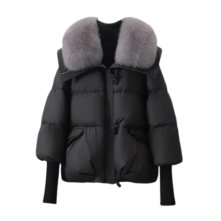 Detail of the quilting on a women's warm winter puffer jacket with a stylish faux fur collar