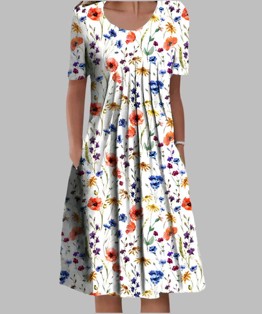 Women's floral print midi dress with short sleeves and convenient pockets, ideal for summer casual wear.