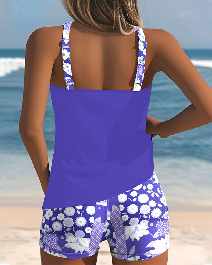 Active women's floral tankini & boyshort set. Perfect for swimming, beach sports, and summer fun.