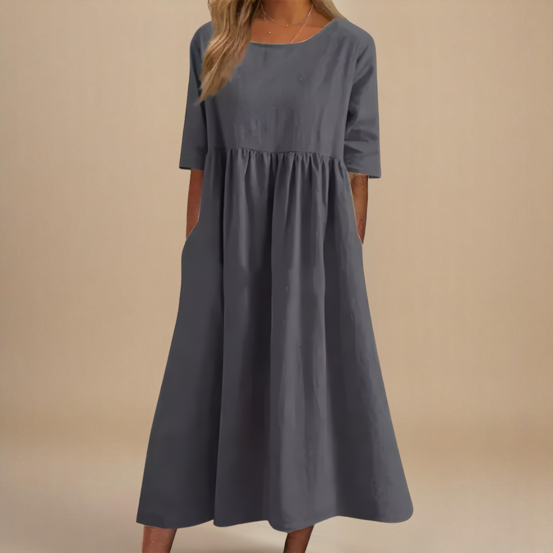 Comfortable women's casual midi dress with empire waist & half-sleeves for relaxed summer style.