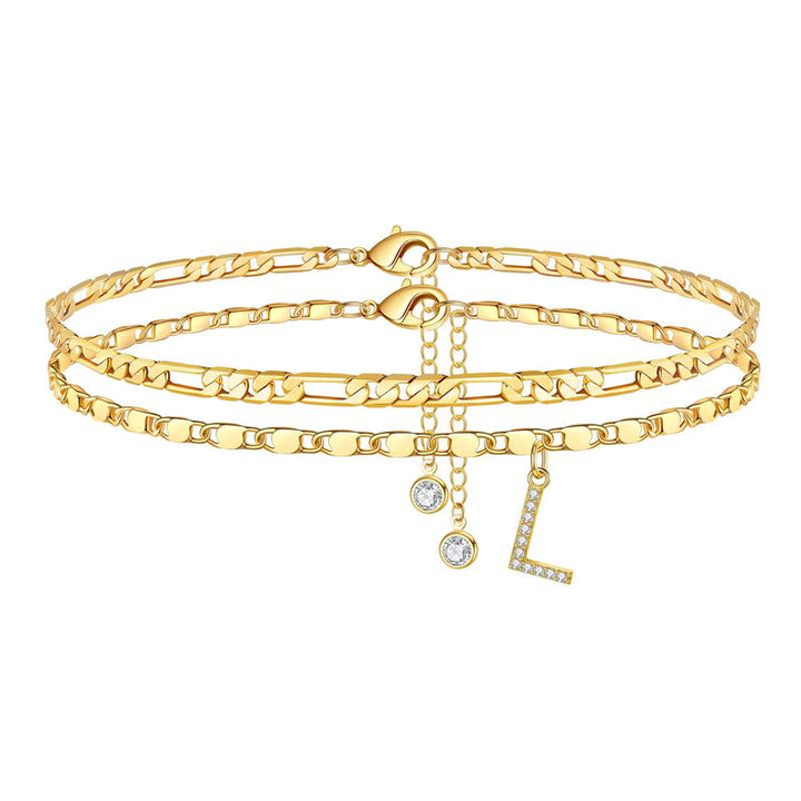 Adjustable gold anklet for women featuring an 'I' initial and a sparkling crystal, stainless steel