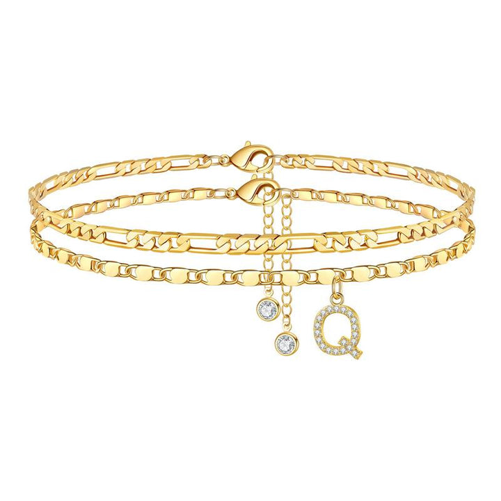 Elegant women's gold initial 'N' anklet with a shimmering crystal, personalized accessory