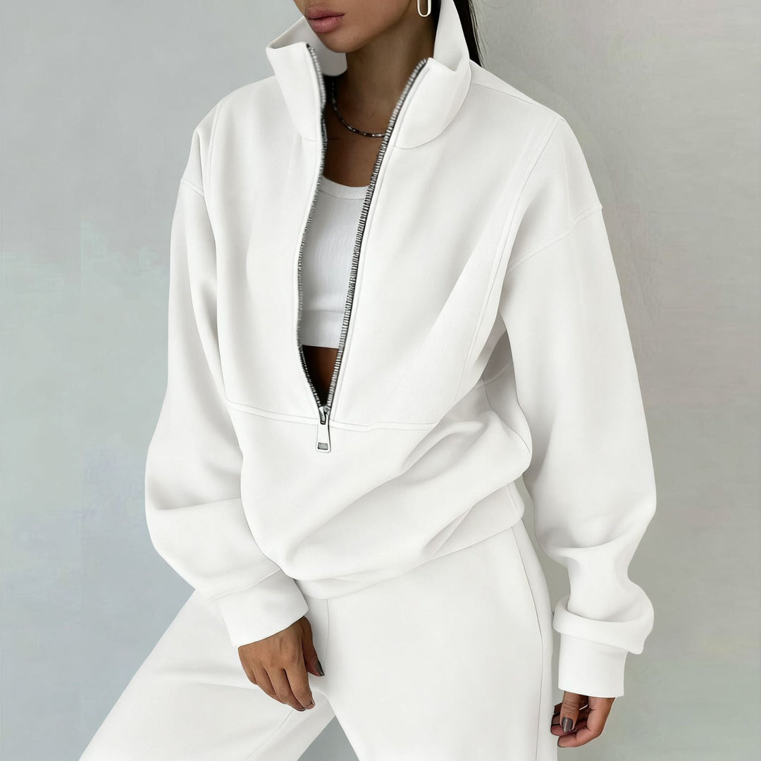 Versatile women's matching sweatsuit. Half-zip pullover & high-waist joggers for athleisure, travel, or everyday comfort.