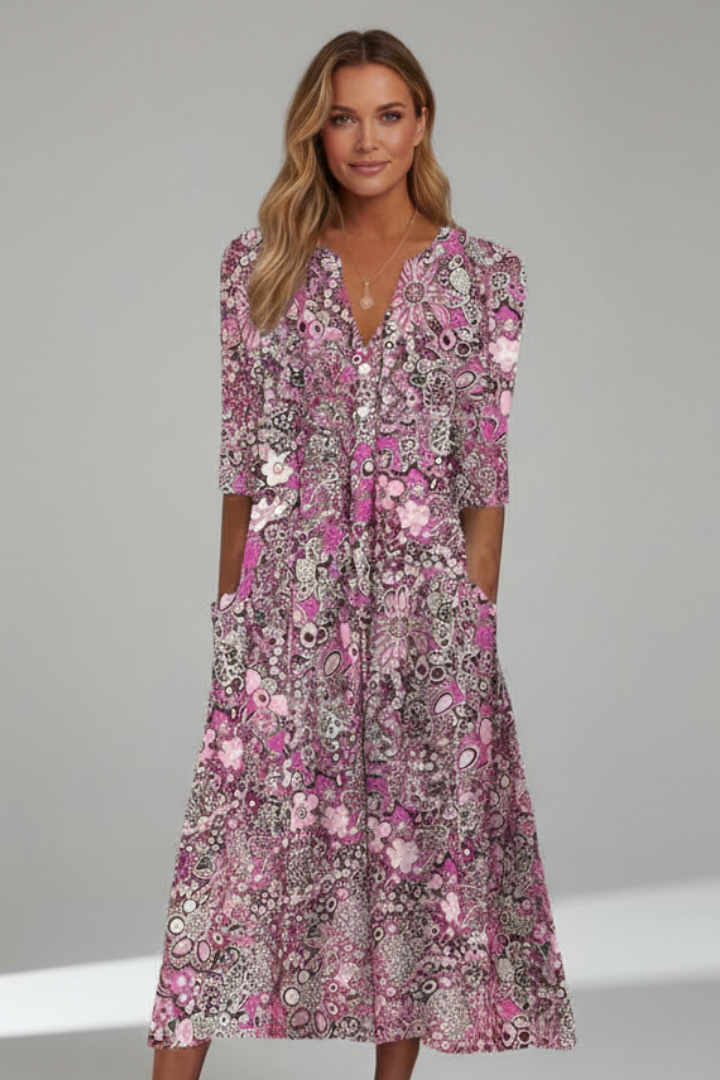 Beautiful women's midi dress with a V-neck, three-quarter sleeves, offering a comfortable and stylish fit.