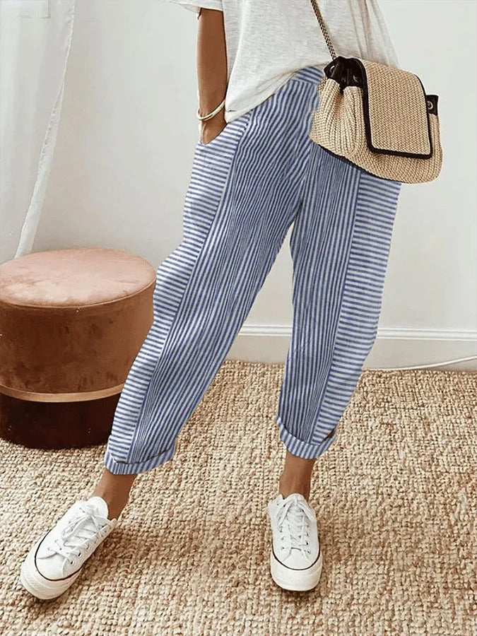 Women's multi-color striped trousers with relaxed fit & elastic waist, perfect for casual comfort.