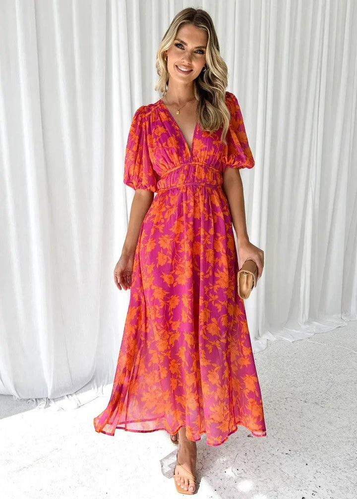 Chic women's orange midi dress with V-neckline and puff sleeves, a must-have for summer and spring fashion.