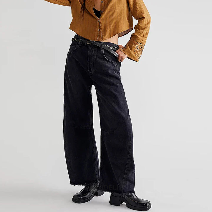 Casual women's organic cotton high-rise jeans, loose fit with a modern straight leg and frayed hem.