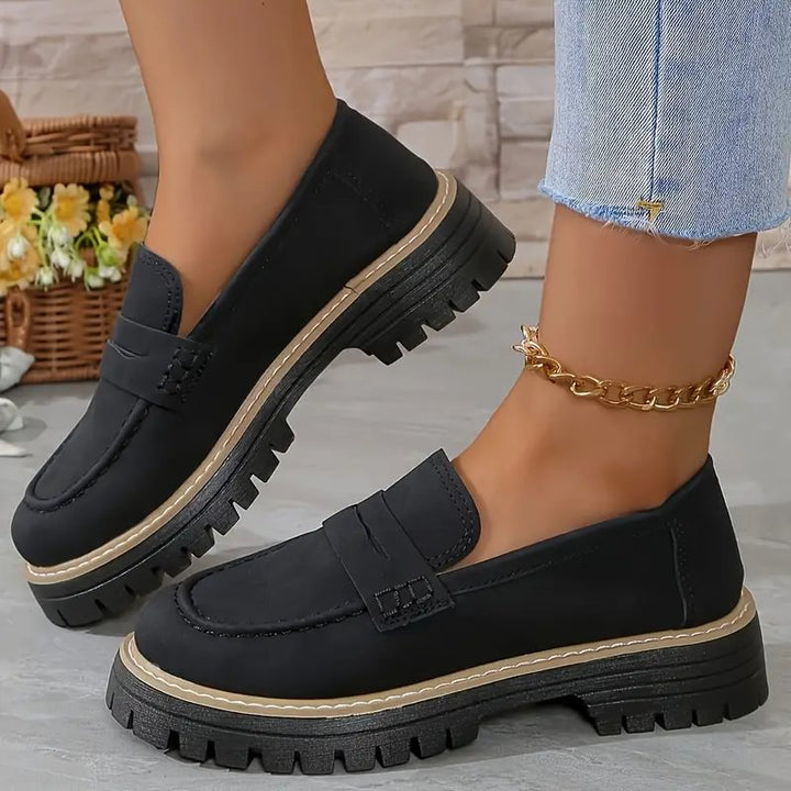 Grey supportive women's walking shoes, designed as slip-on loafers with wide toe box.