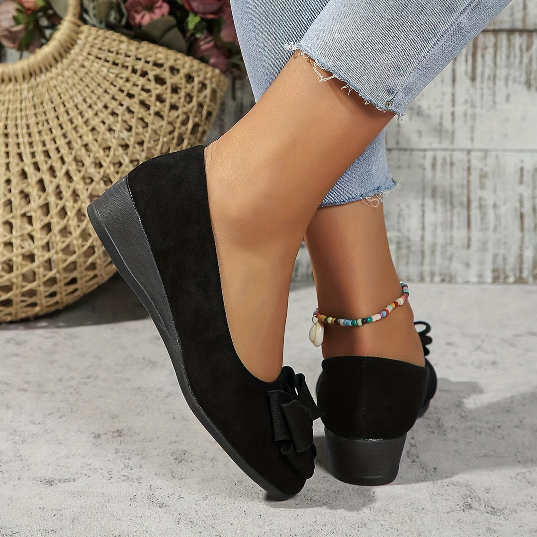 Black women's orthopedic flats, slip-on style, providing all-day comfort & support.