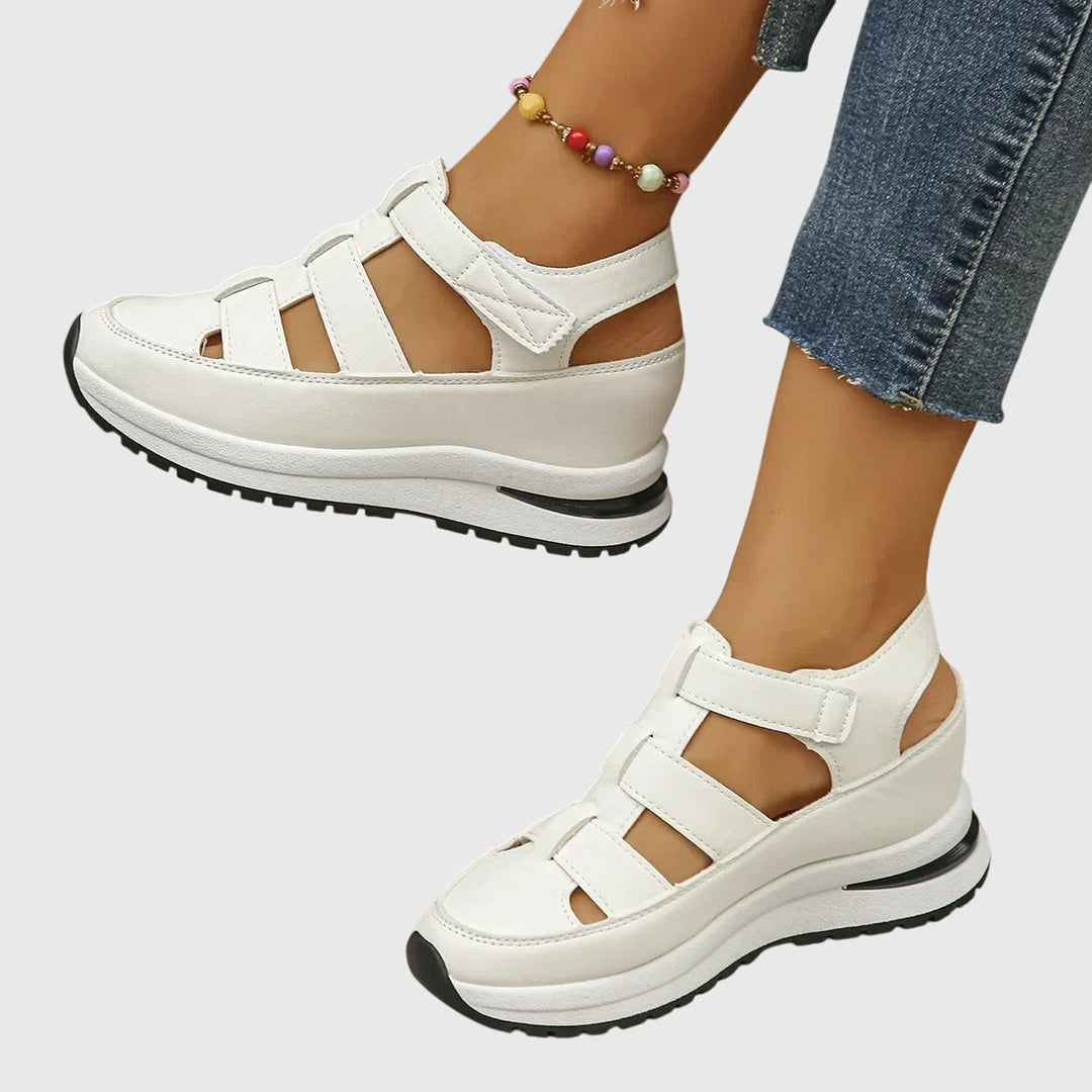 Black women's orthopedic sandals, offering excellent arch support and adjustable comfortable fit.