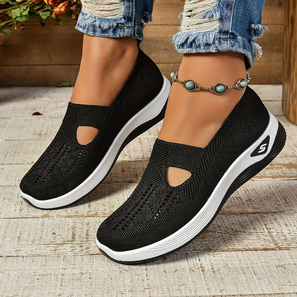 Close-up of women's perforated slip-on sneakers, offering orthopedic comfort and casual style.