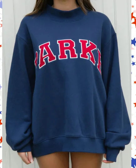 Effortless fall & winter style with this women's oversized graphic crew neck pullover sweater.