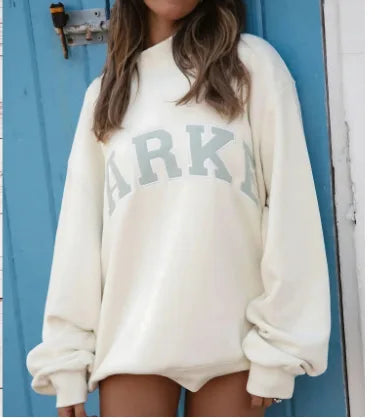 Comfortable & trendy women's oversized graphic sweater; a loose fit, long sleeve pullover.