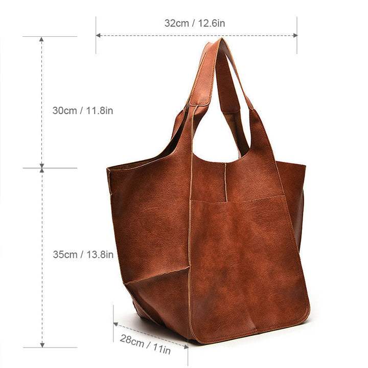 Travel-ready women's oversized vintage leather bag, a spacious shoulder bag for all essentials.