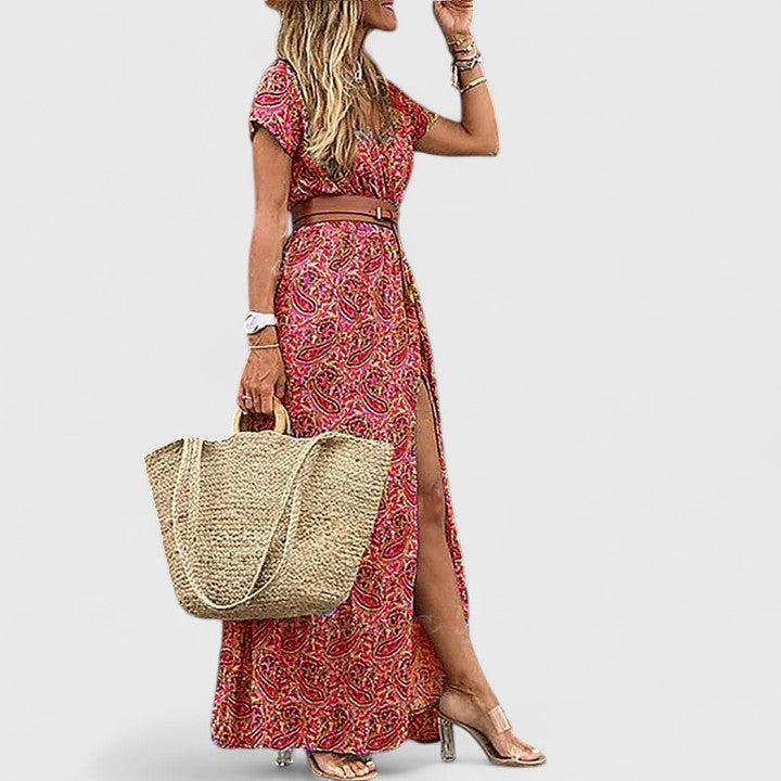 Vibrant paisley print women's maxi dress, V-neck, short sleeves, and a flattering belted boho silhouette with side slit.