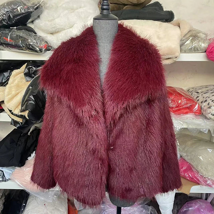 Back view of a women's relaxed fit faux fur jacket, showing its comfortable and fashionable silhouette.
