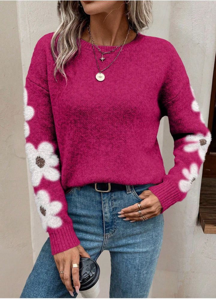 Women's fall fashion: a relaxed knit long sleeve sweater with an adorable daisy print.