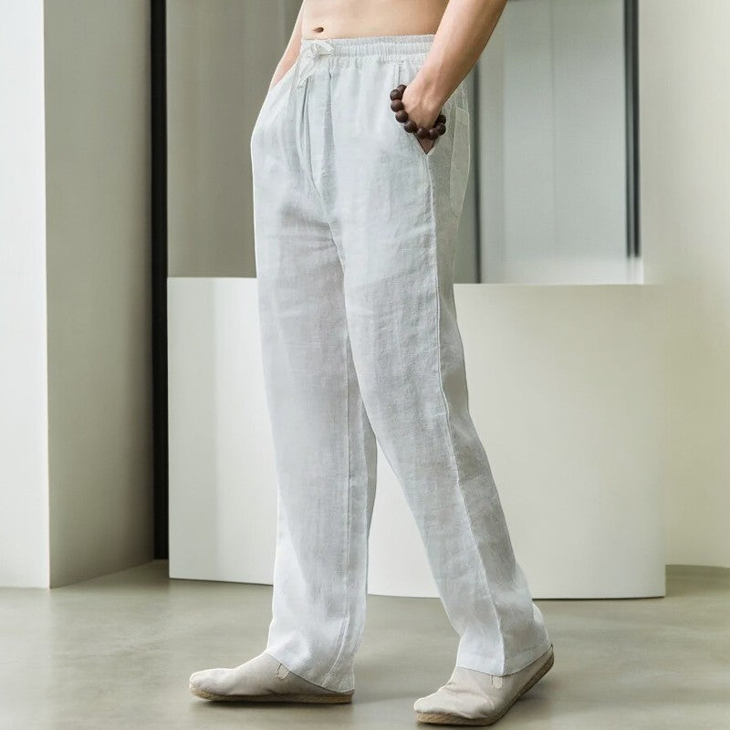 Pair of laid flat women's relaxed fit linen pants, highlighting the wide leg and soft texture