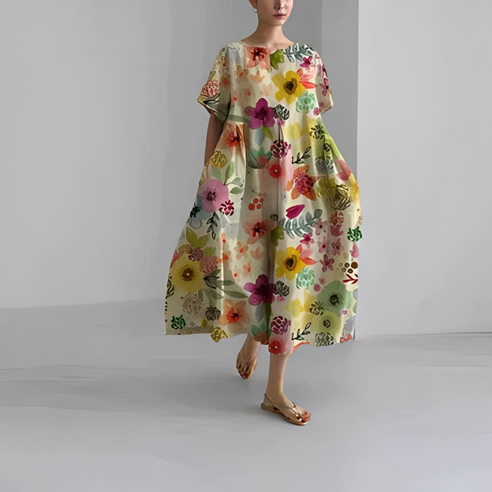 Elegant women's floral print midi dress, relaxed fit, suitable for a stylish summer look.