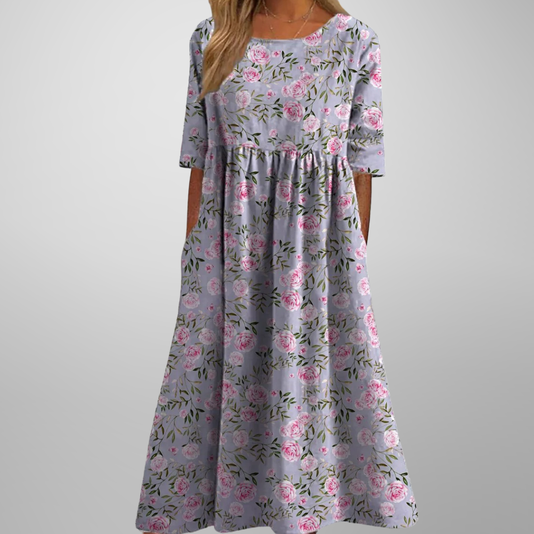 Full length view of a women's relaxed floral midi dress, showcasing its elegant flowy design.
