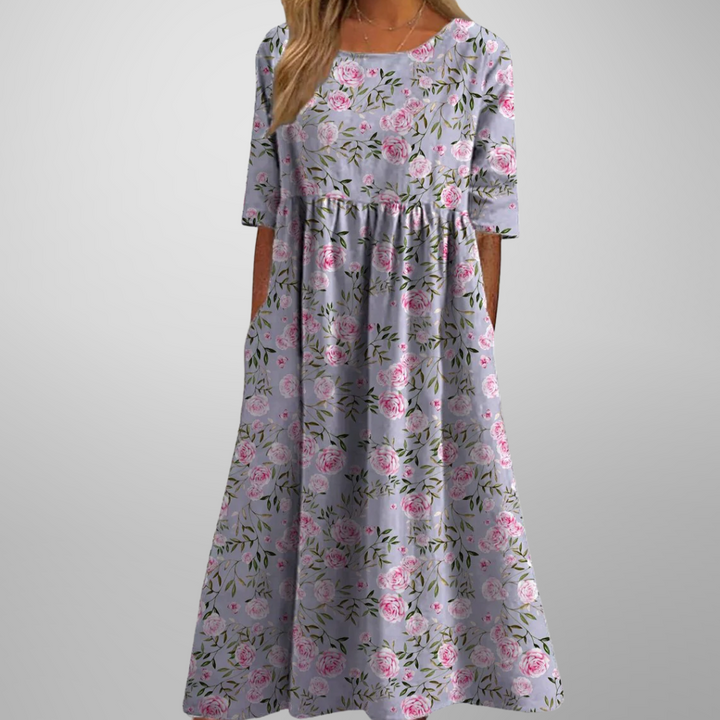 Full length view of a women's relaxed floral midi dress, showcasing its elegant flowy design.