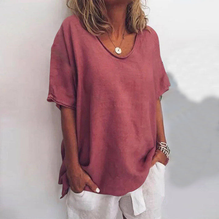 Women's solid color scoop neck loose fit blouse. Short sleeve casual top for easy everyday fashion.