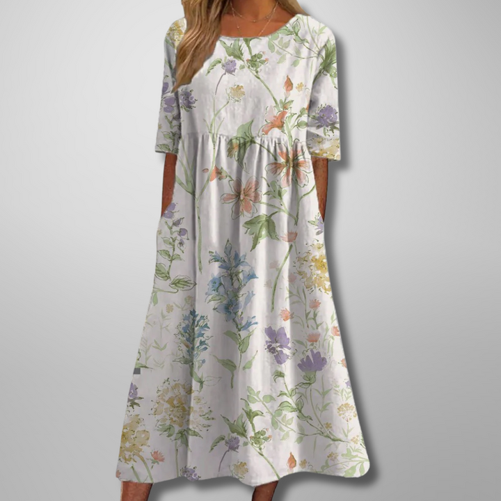 Casual summer style women's midi dress with short sleeves, loose fit, and a beautiful botanical print.