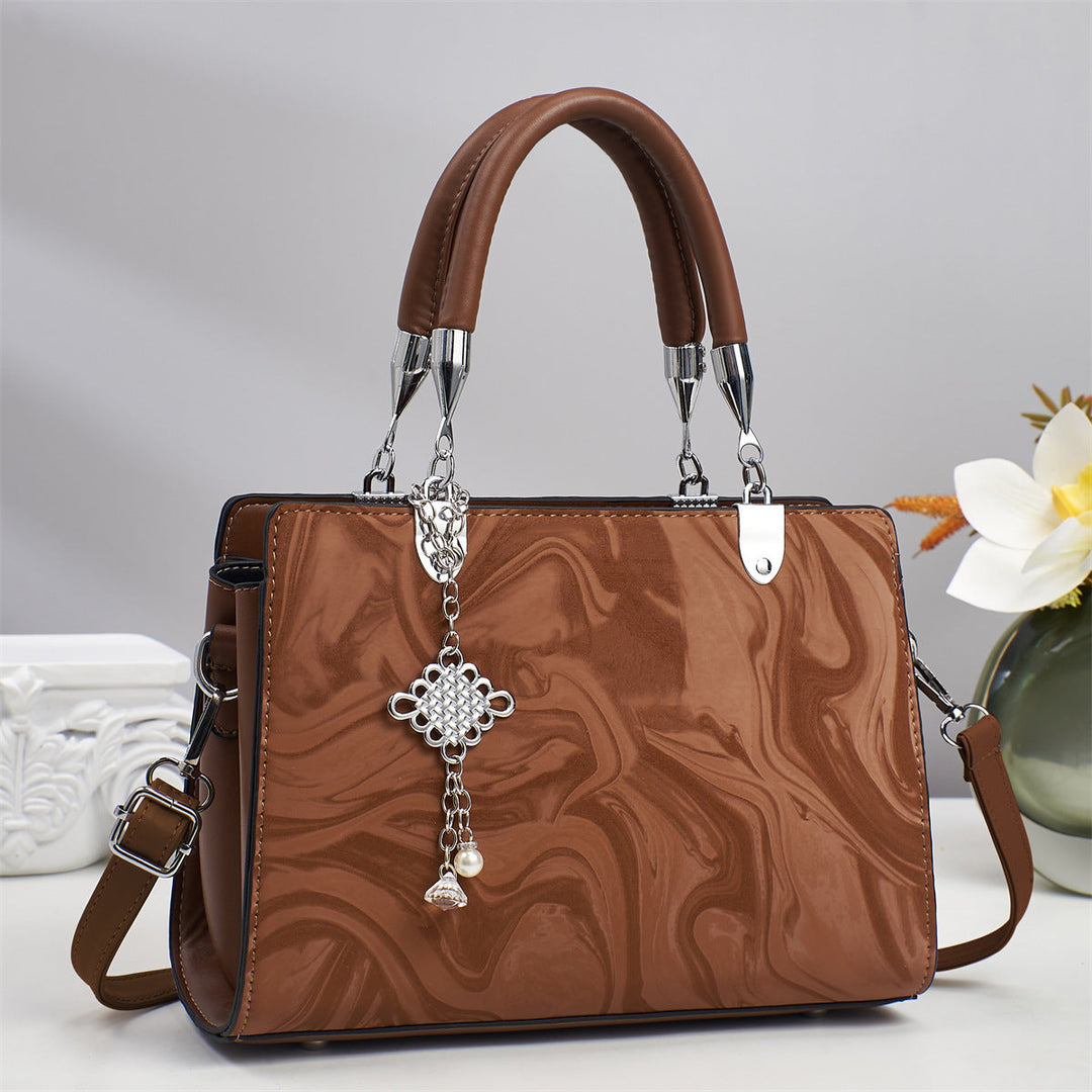 Sleek and minimalist women's square crossbody bag, an essential fashion accessory with a chain strap