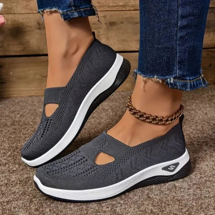Side view of modern women's slip-on shoes, showcasing their sleek design and cushioned sole.