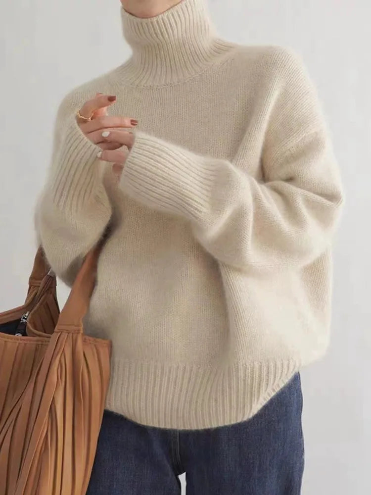 Close-up of a premium cashmere funnel neck sweater for women, showing soft knitwear texture