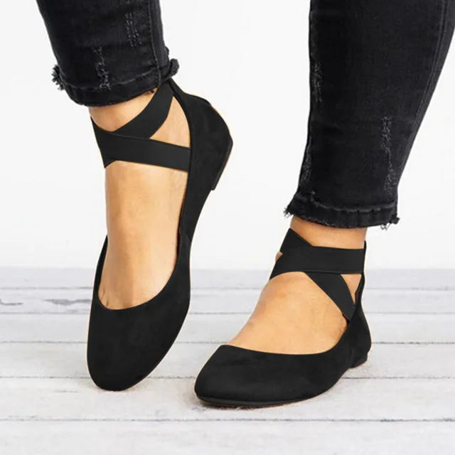 Pair of elegant women's cross-strap ballet flats, perfect for spring casual or versatile wear