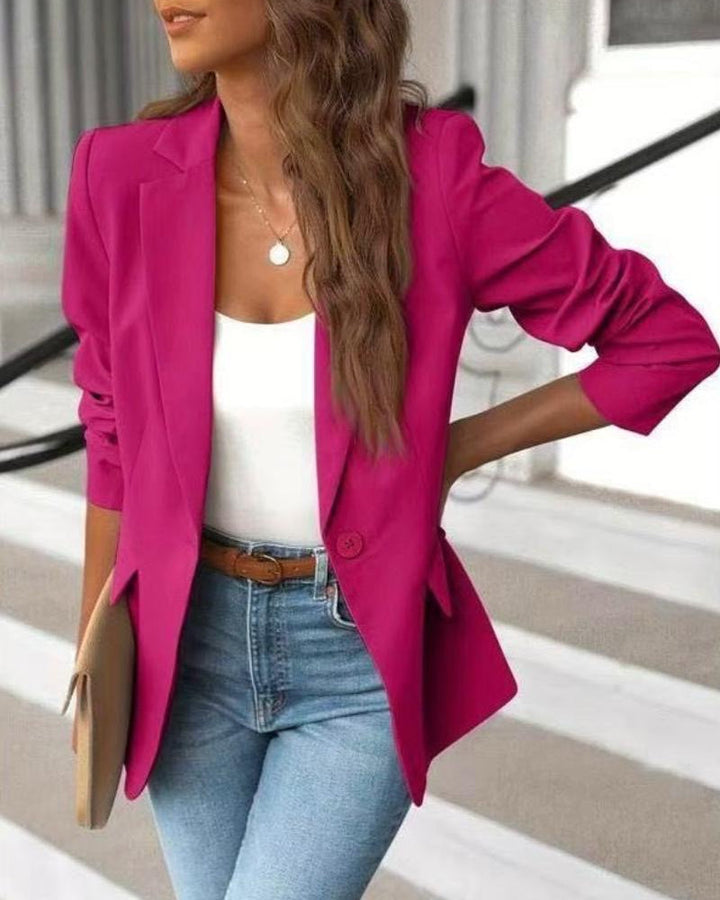 Stylish women's tailored blazer featuring fashionable ruched sleeves & a single button closure, ideal for professional women.