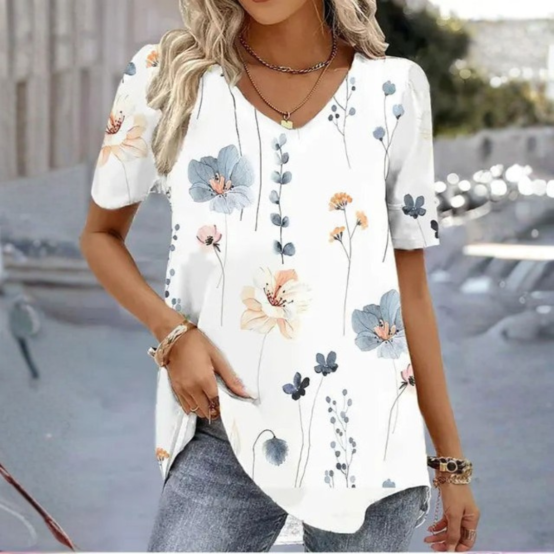 Stylish women's V-neck graphic tee in a relaxed fit. Comfortable short sleeve printed shirt for everyday casual wear.